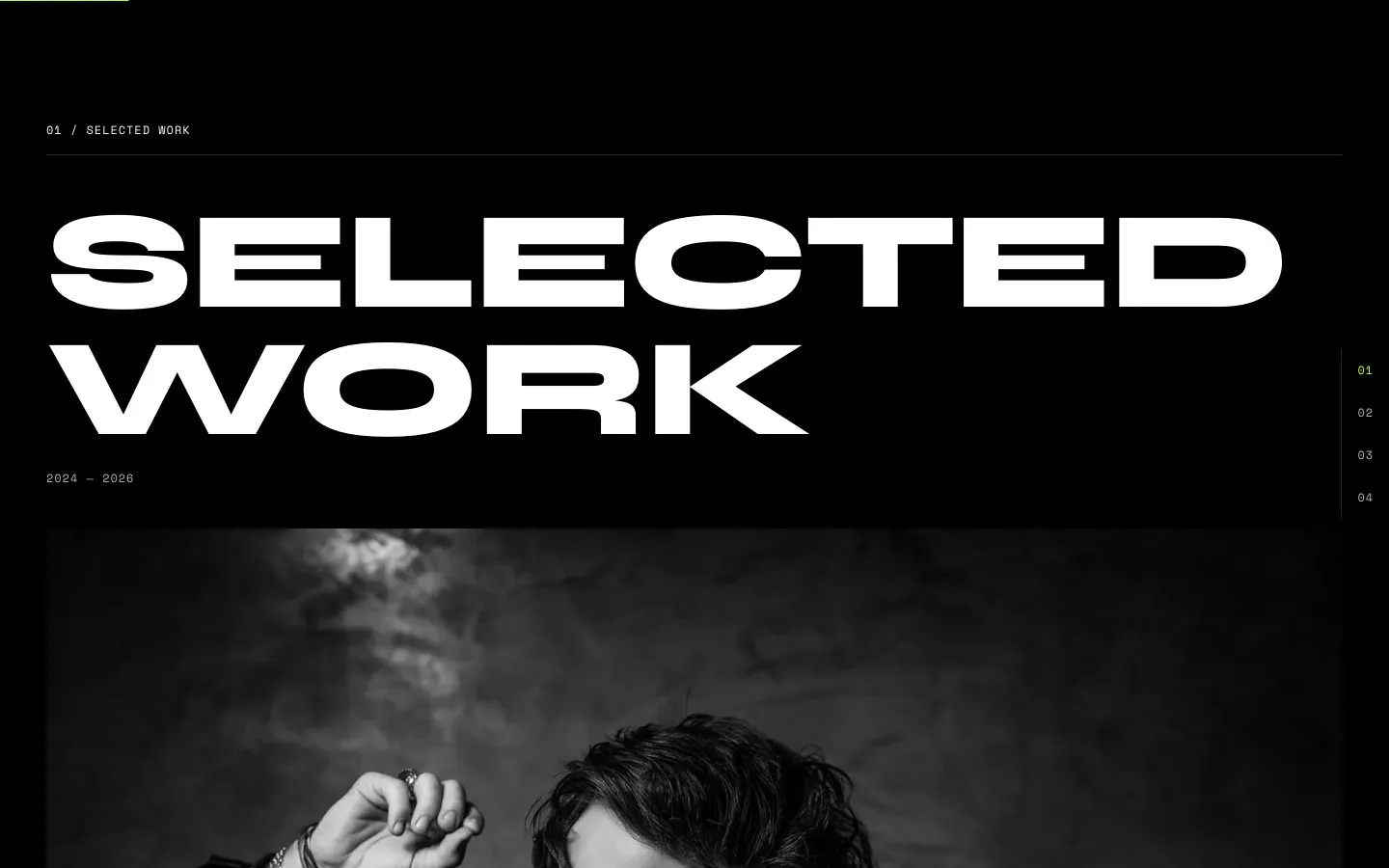 The Selected work section with a large black and white project photo